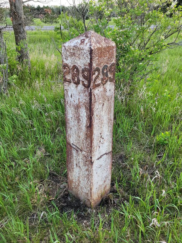 Cast Iron mile marker found in Big Rapids MI prior to refurbishing work.