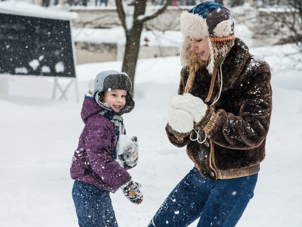 Nanny playing in the snow