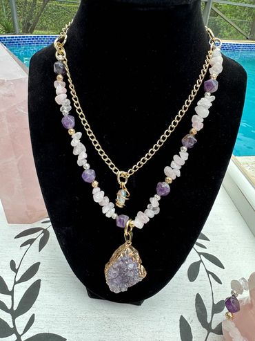 Necklace crafted with rose quartz and amethyst beads, adorned with raw amethyst and clear quartz
