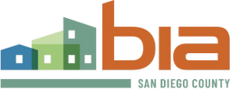 Logo of a real estate company with colorful house icons and text.