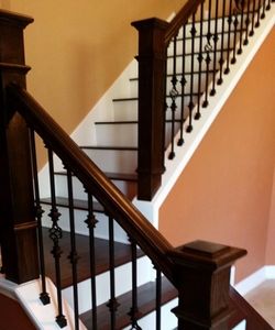 Hardwood flooring, newels, staircase renovation, iron balusters, risers, treads