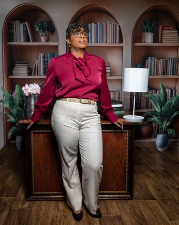 Commercial executive branding portrait in library setting with crimson blouse photography by RedHed,