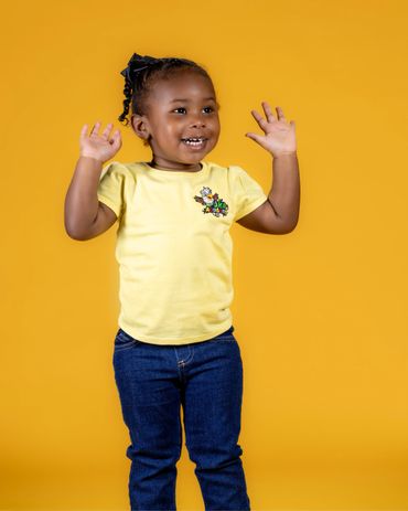 Commercial brand photography of young girl in branded academy uniform against gold background RedHed