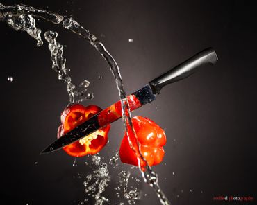 Creative commercial product photography with red pepper and knife water splash RedHed, Tallahassee F