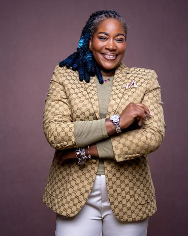 Luxury personal branding headshot with Gucci blazer and warm studio backdrop — RedHed Photography, T