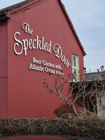 The Speckled Door pub with a beer garden and Atlantic Ocean views.