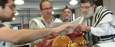 Saranac Synagogue members preparing a Torah reading the Saranac Synagogue, Congregation Achei Tmimim, Buffalo, NY.