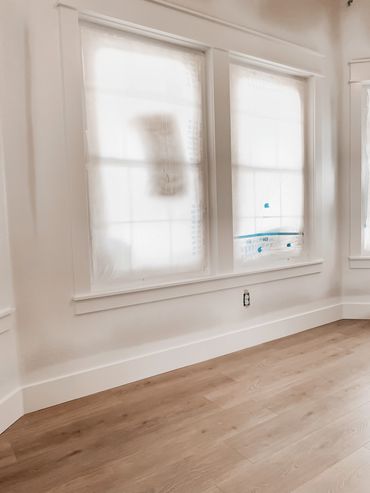 freshly painted interior space with white walls and window trim