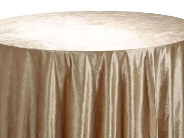 Champagne velvet tablecloth on a round table.
