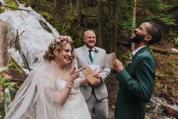 Bride, groom & officiant at waterfall elopement.
copyright Marissa Solini Photography
