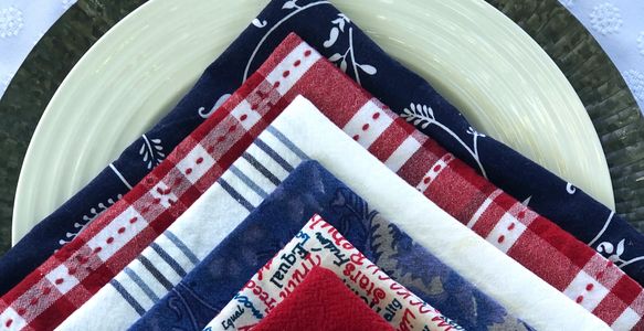 red, white and blue napkins on a white plate