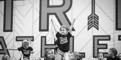 Intro to All Stars cheerleading teams practice cheer and tumbling and showcase in the gym.