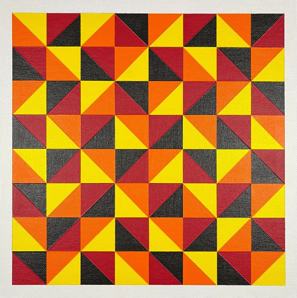Colorful geometric pattern with triangles in yellow, red, orange, and black.
