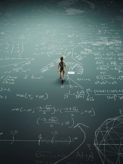 Person walking on floor covered in complex mathematical and scientific formulas.