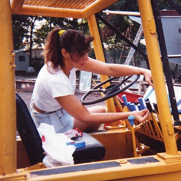 Photo of Toni operating her crane at the boatyard.