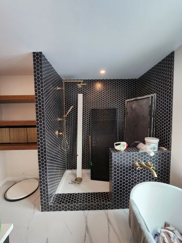 Elegant, modern en suite shower with deep soak tub.
