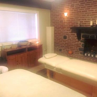 Reiki studio space shows dimly lit relaxing environment for Reiki sessions.