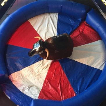 Aerial view of BullMan Mechanical Bull surrounded by a red white and blue inflatable crash mat