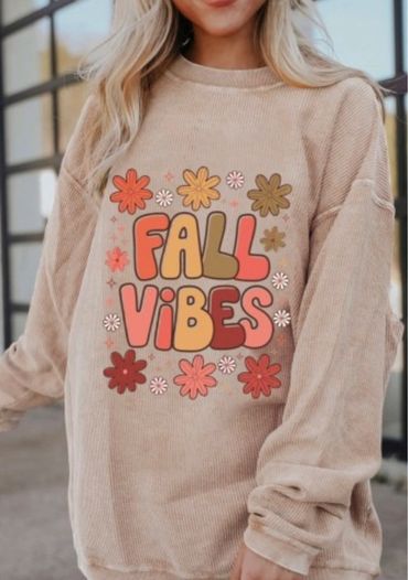 Beige sweatshirt with colorful "Fall Vibes" and flower design.