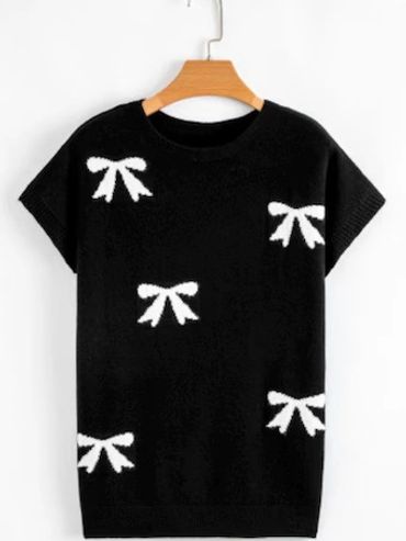 Black sweater with white bow patterns, short sleeves.