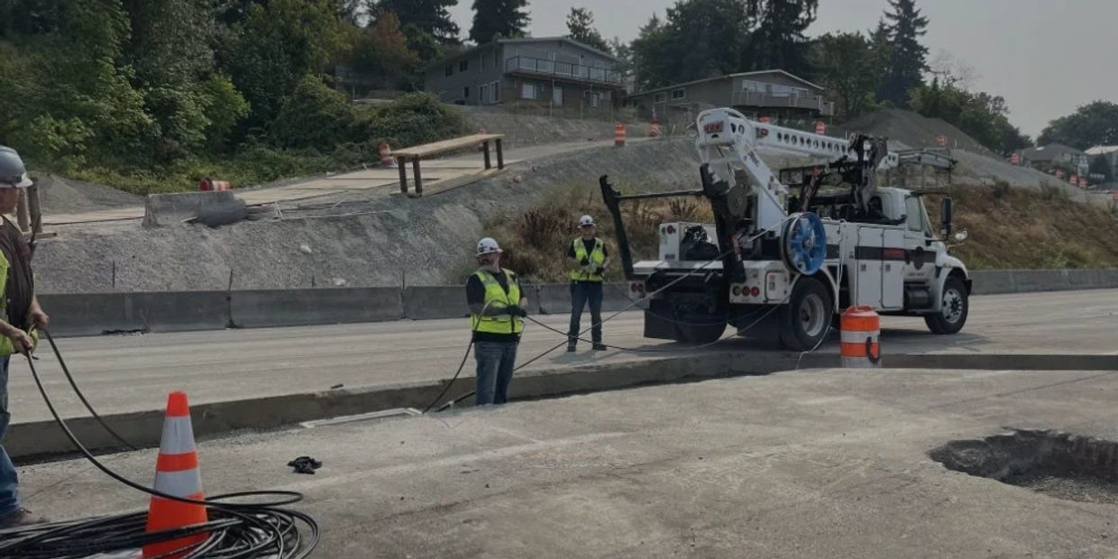 SABER Technologies truck and three individuals installing outside plant cabling