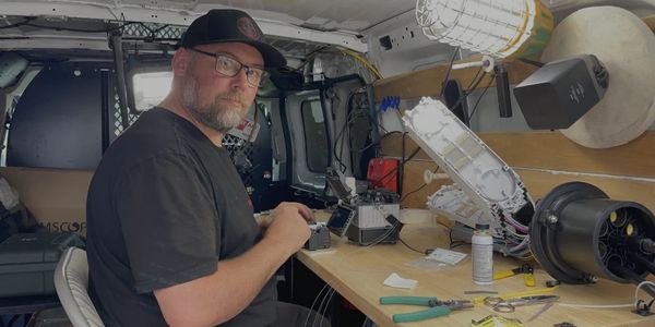 Individual inside a splicing van fusion splicing optic cables