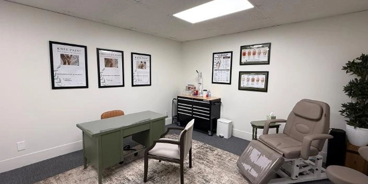 Modern medical consultation room with chairs and informative posters.