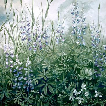 Delicate purple and white wildflowers under a cloudy sky.