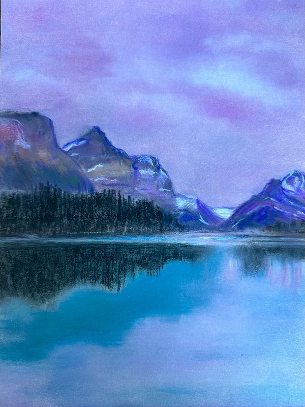 Mountain sunrise reflected in lake