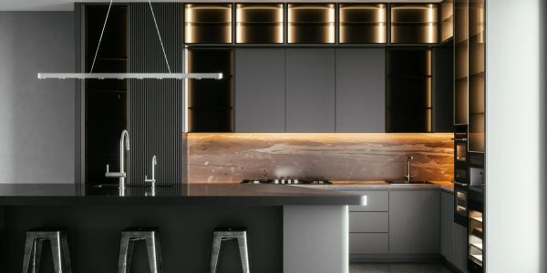 Modern kitchen with black cabinetry and warm backlighting.