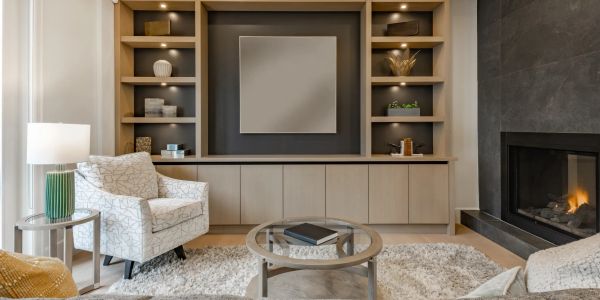 Cozy living room with modern fireplace and neutral-toned decor.