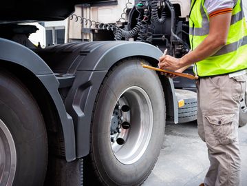 technician performing tire inspection