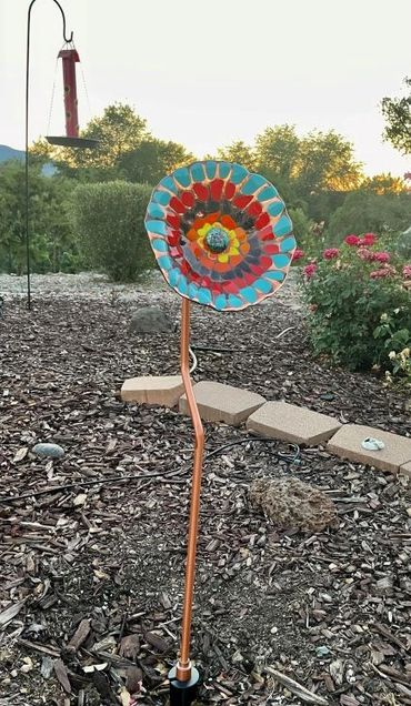 Flowers that don't require water.  These fused glass flowers are almost 3 ft tall.