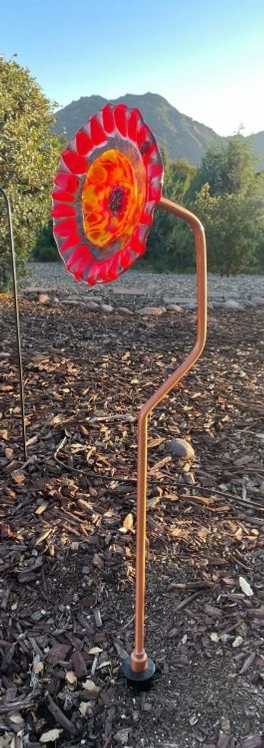 Flowers that don't require water.  These fused glass flowers are almost 3 ft tall.