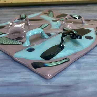 View from the side of this multi-dimensional fused glass hanging art piece.