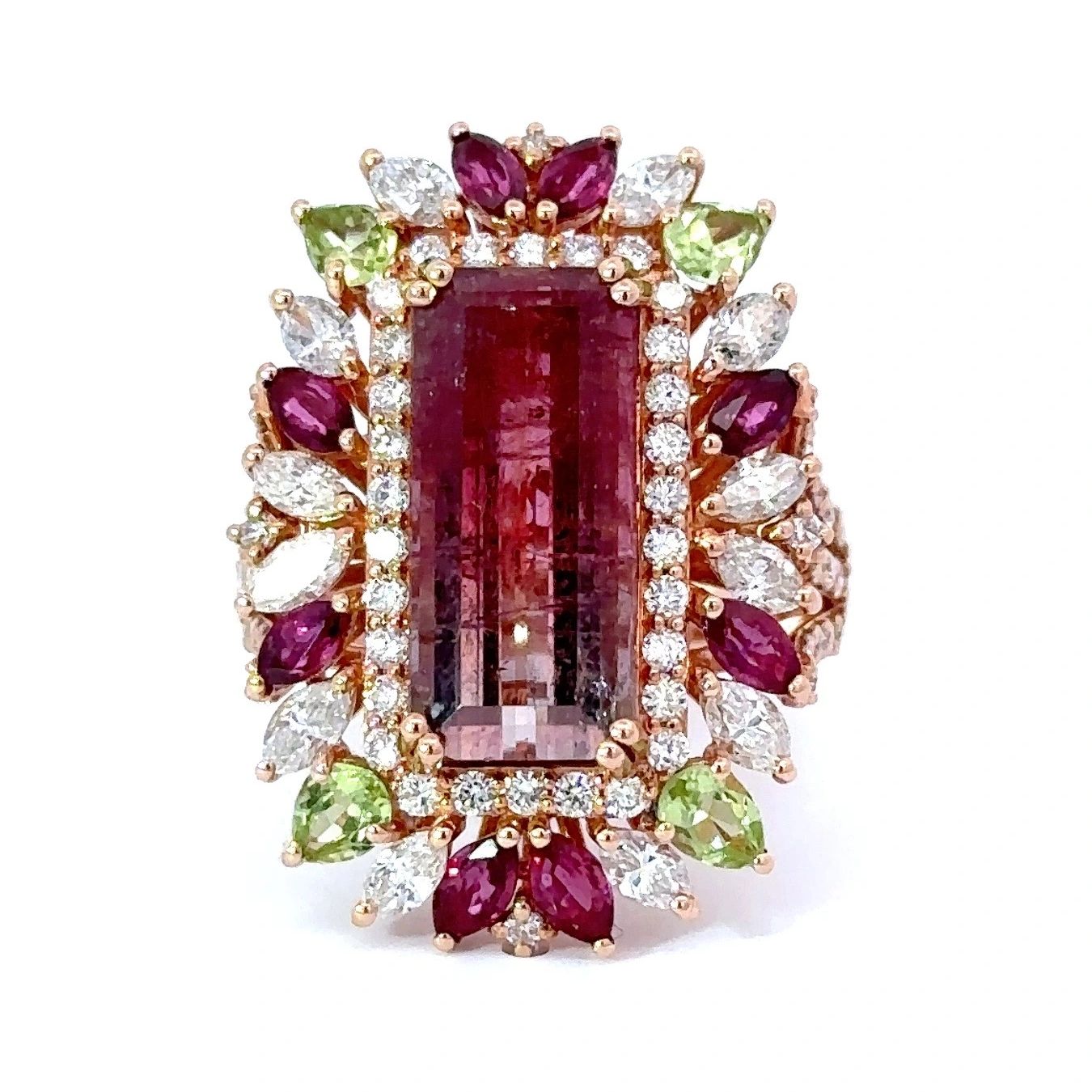 Stunning Bicolor Tourmaline ring, set in yellow gold, accented with diamonds, rubies & peridot.