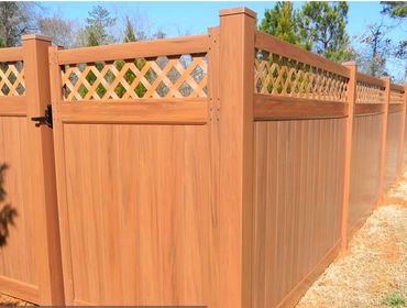 Tall vinyl privacy fence with lattice top showing multiple color options