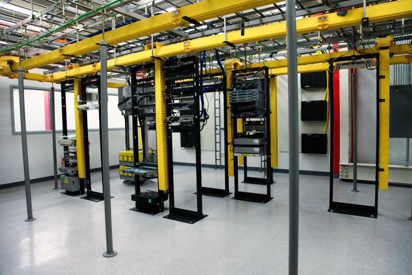 Firewall-equipped server rack system at the OKC Data Center, symbolizing network security solutions.