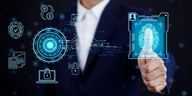 A Person pressing their thumb against a screen to verify their identity.  Identity Management.