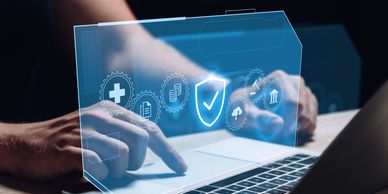 A person with their finger on a touchpad, and looking at a screen for Secure Access Service Edge.