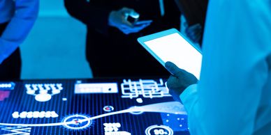 A team of people gathered around a digital desk representing Incident Response Services.