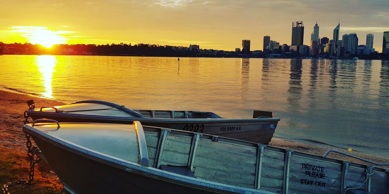 Perth CBD as seen from Mill Point foreshore in South Perth during sunset.
