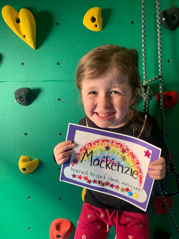Kid learnt to rock climb in intensive physiotherapy