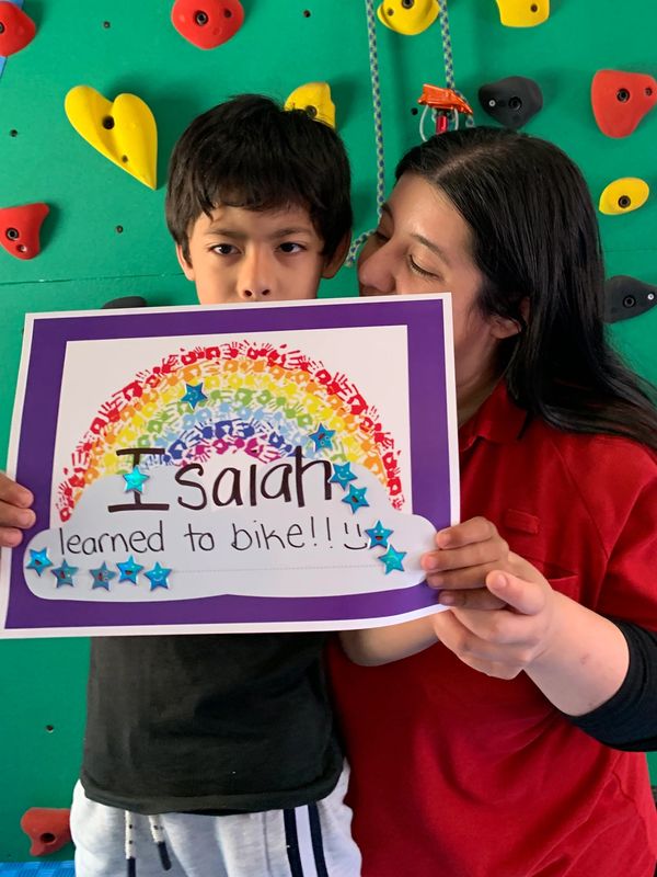 kid with disability learnt to ride a bike in intensive physiotherapy