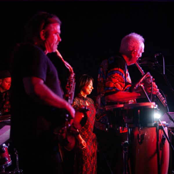 Tenor saxophone player and the flutist from Blueberry Jam jazz band playing bossa music.