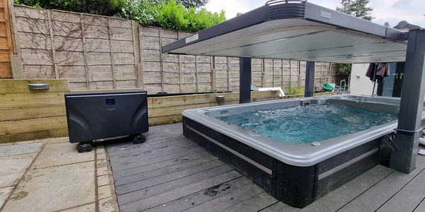 Zealux Inverboost 14Kw UX air source heat pump installation on a Hydropool 19DTFX Swimspa