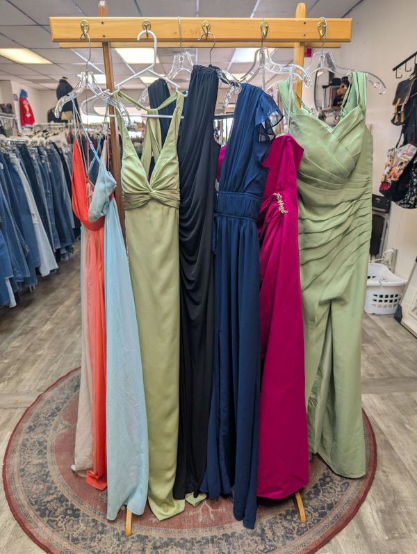 Grouping of formal dresses in various colors