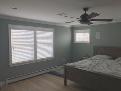 White wood blinds in a Jersey Shore bedroom.