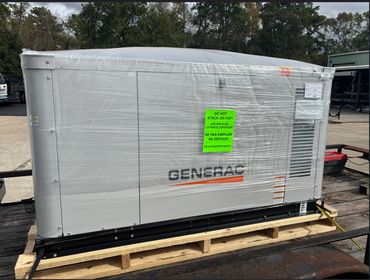 A Generac generator wrapped in plastic with a 'Do Not Stack On Top' sign.