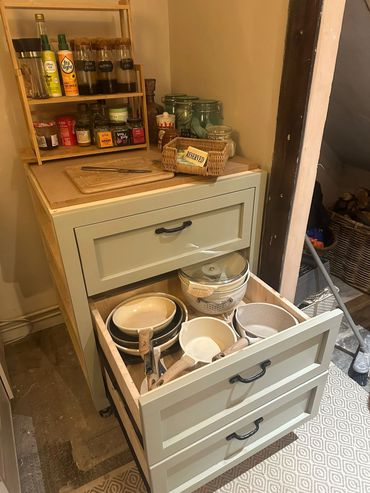 Organized rustic kitchen drawers.